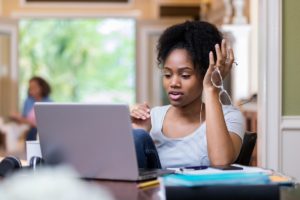 African American girl receiving online tutoring